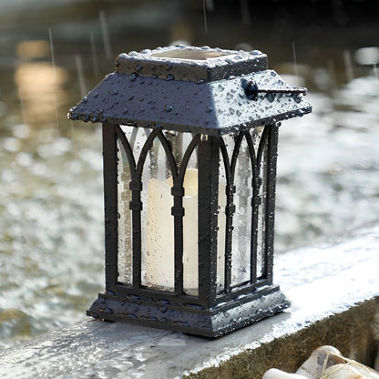 Wicklow lantern on a garden pathway with lush greenery — Casa Norex