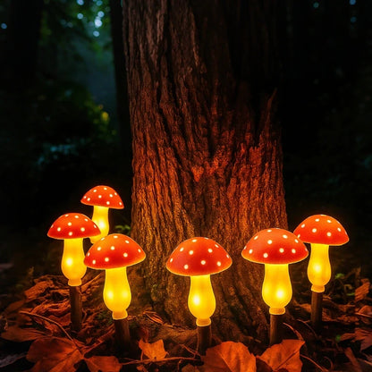 Solar mushroom garden lights in red glowing at the base of a tree | Casa Norex