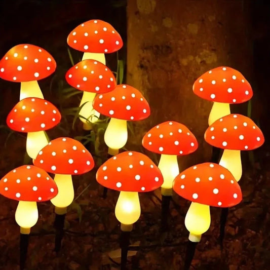Red solar mushroom lights on ground stakes in a woodland garden bed | Casa Norex