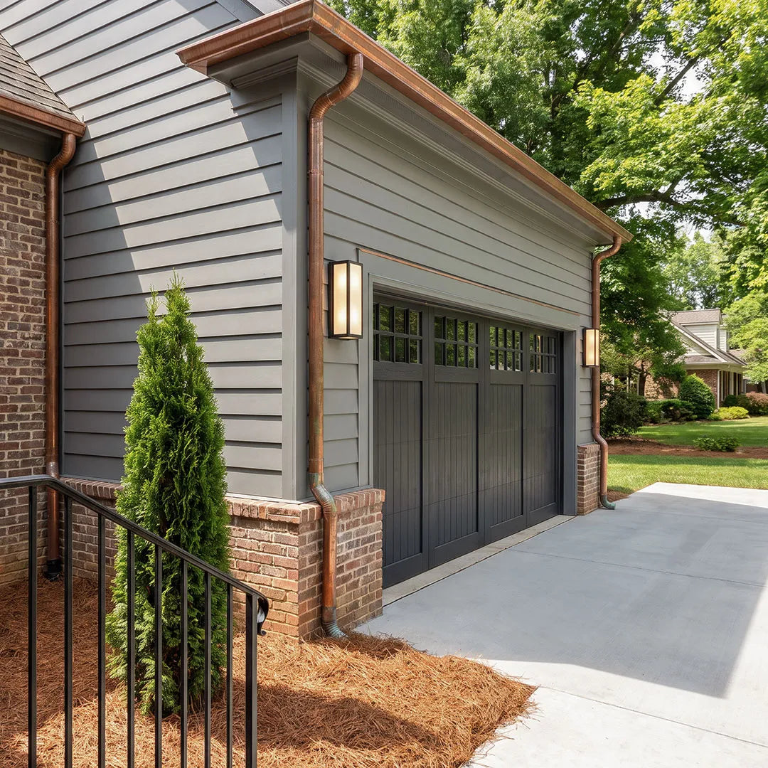Ashby wall light on a garage and home exterior — Casa Norex