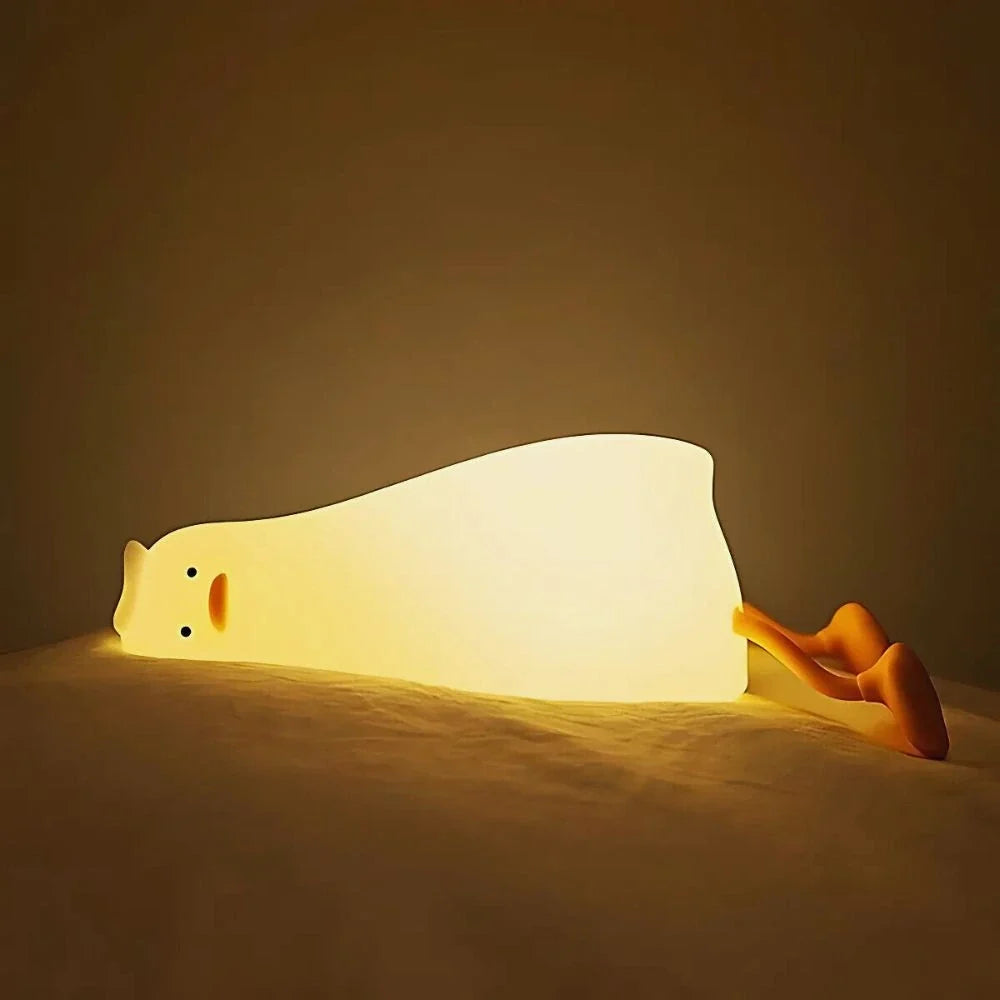 Lazy Duck silicone night light lying down and glowing | Casa Norex