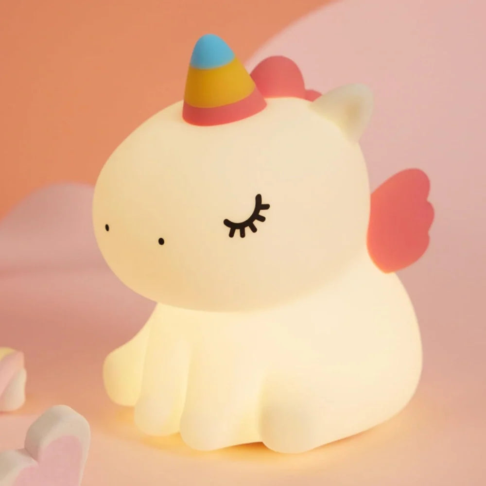 Unicorn silicone night light with a pink horn and closed eyes — Casa Norex