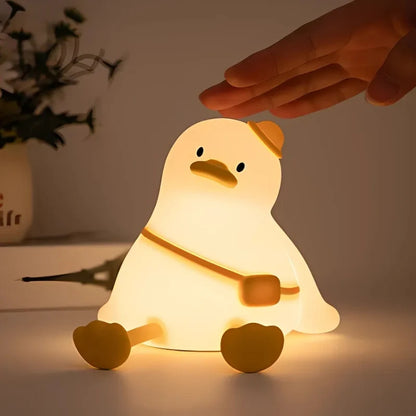 Hand about to tap a sitting duck night light — Casa Norex