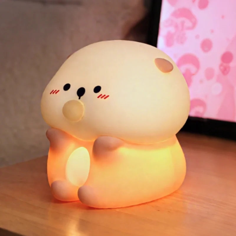 Hippo Baby night light glowing against a pink patterned background — Casa Norex