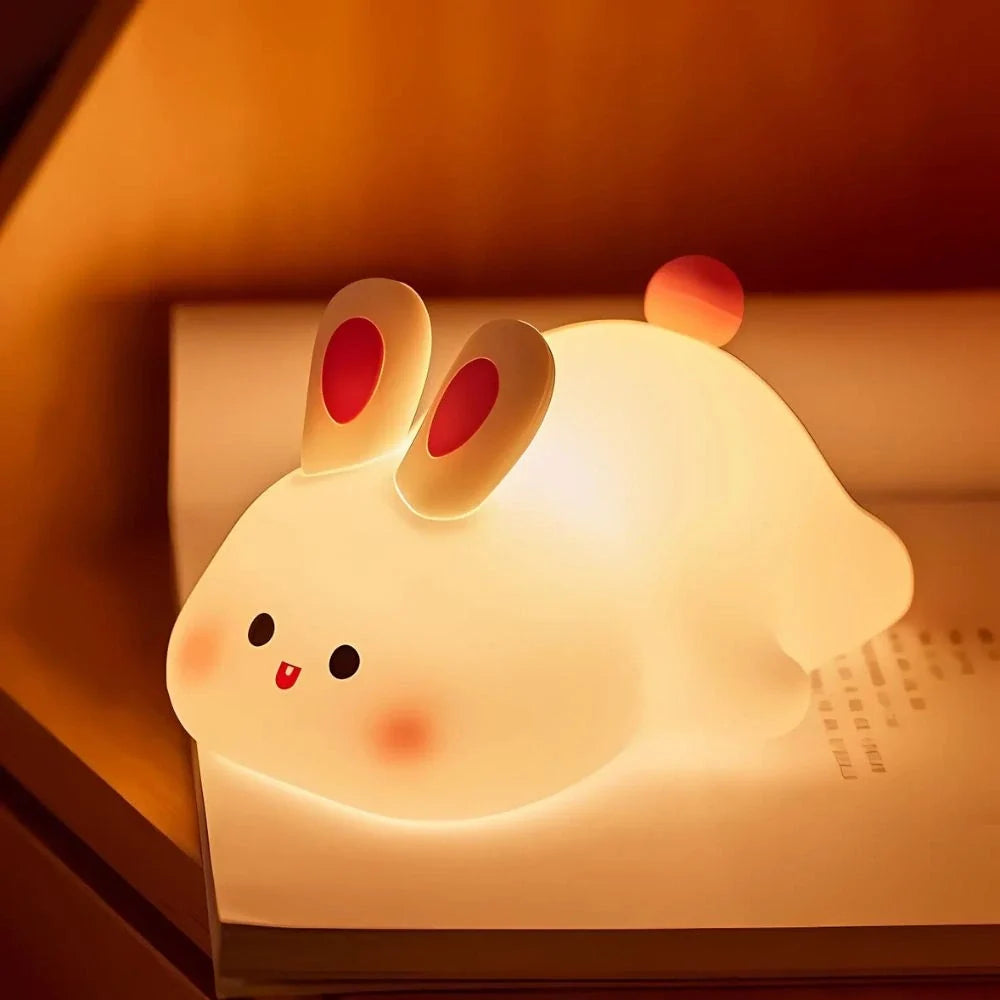 Happy Bunny night light on a wooden surface at night — Casa Norex
