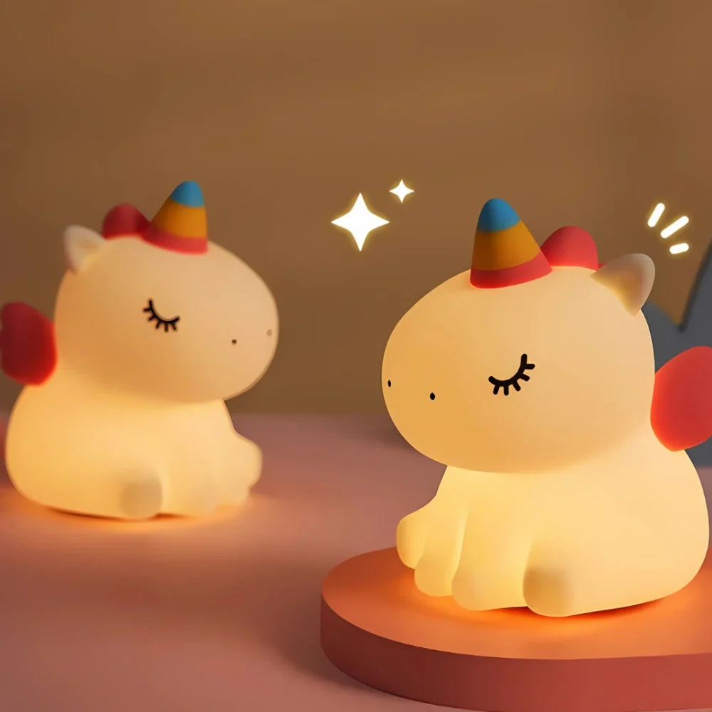 Two unicorn night lights glowing side by side — Casa Norex
