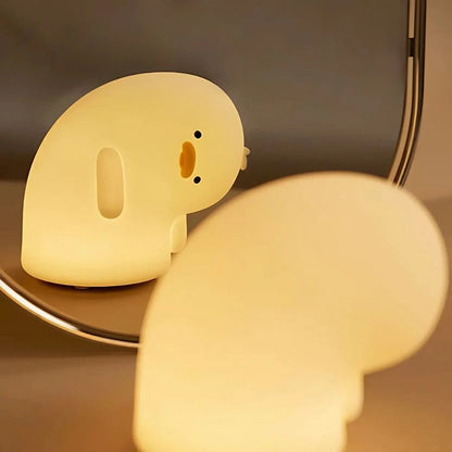 Hippo Baby night light beside a rounded white light — Casa Norex