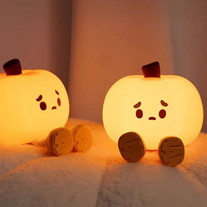 Two pumpkin night lights glowing side by side — Casa Norex