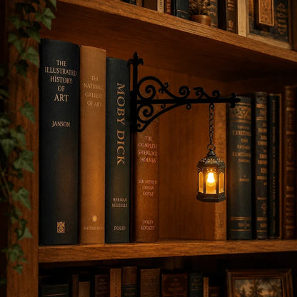 Vintage lantern bookshelf pendant light beside art books on a wooden shelf — Casa Norex