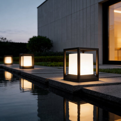 Plinth pedestal light by an infinity pool with warm glow — Casa Norex