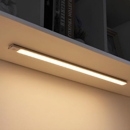 White rechargeable light bar mounted under a shelf with a warm glow | Casa Norex