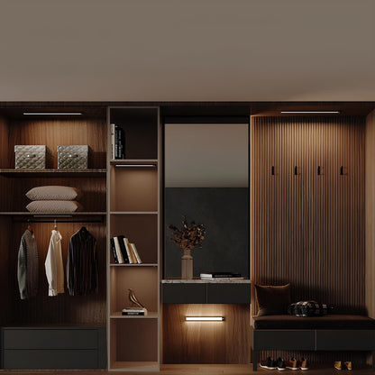 Light bar glowing in a wooden dressing room wardrobe — Casa Norex