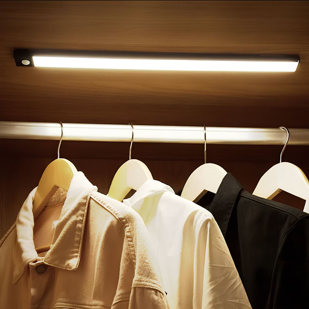 Light bar above jackets hanging on a closet rail — Casa Norex
