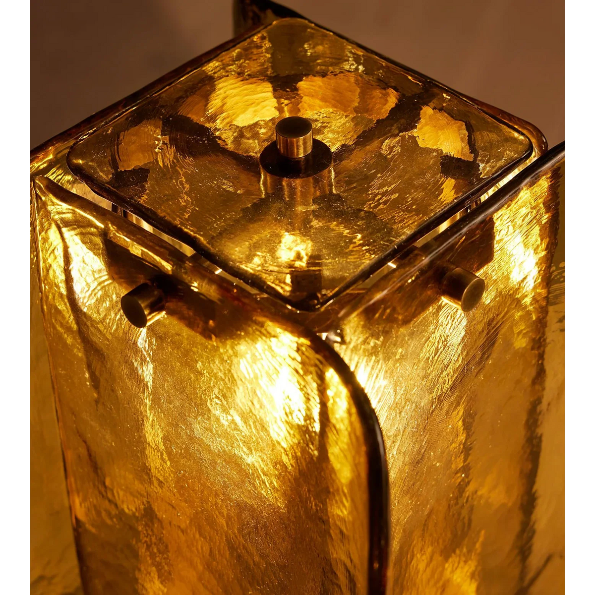 Close-up of hand-formed glass panels on amber table lamp | Casa Norex