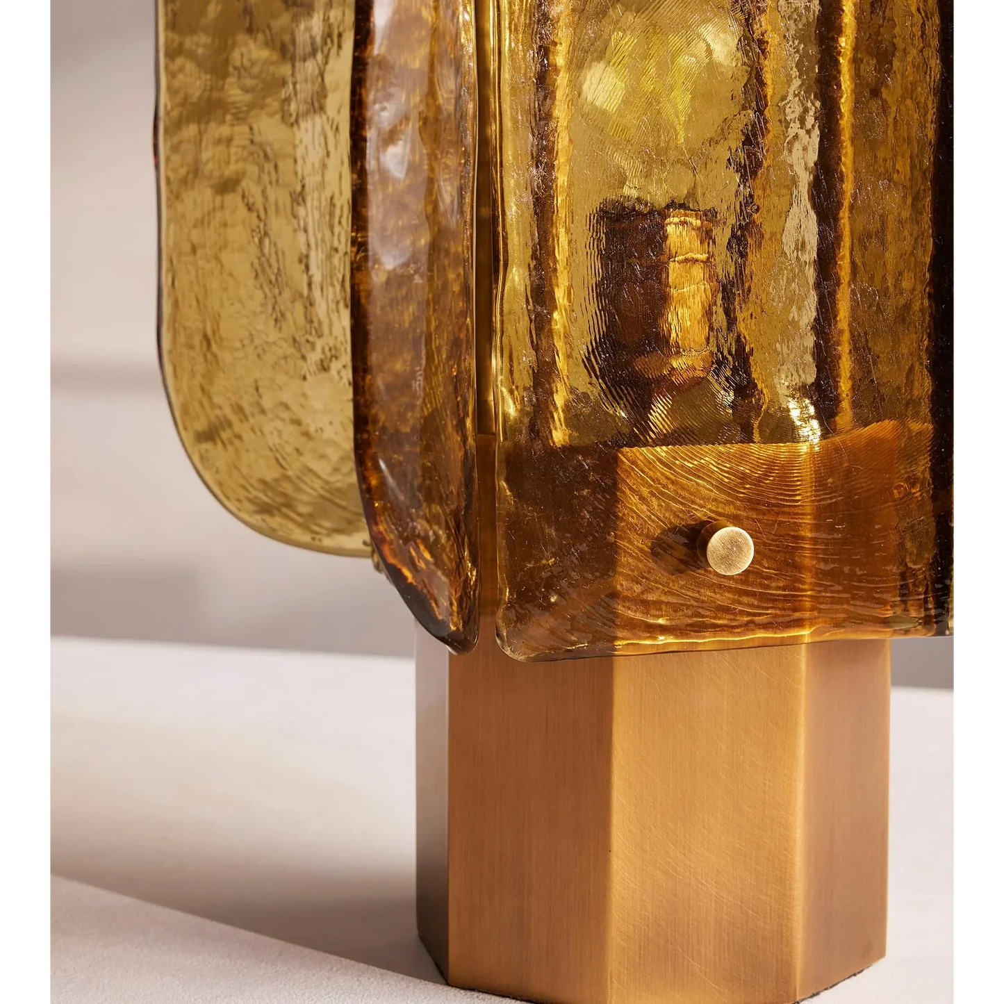 Amber glass table lamp lit — warm 3000K glow detail | Casa Norex