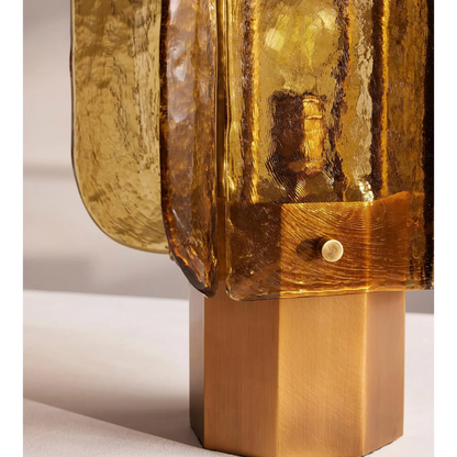 Amber glass table lamp lit — warm 3000K glow detail | Casa Norex