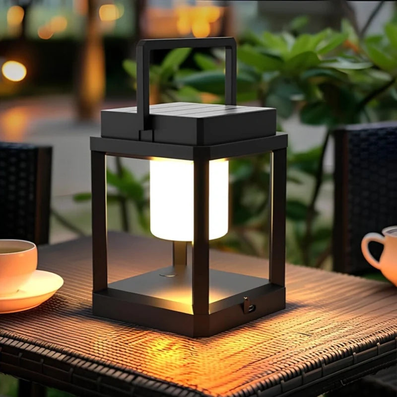 Solar lantern glowing beside a teacup on a wooden table at dusk | Casa Norex