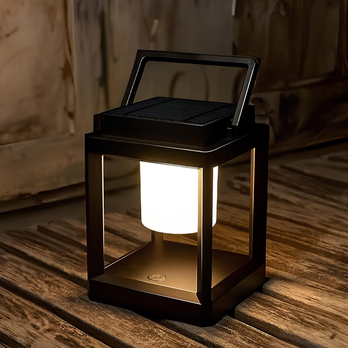 Black framed lantern glowing warm white on a wooden deck | Casa Norex