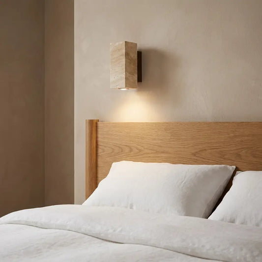 Travertine-style stone-look LED wall sconce — round shade with brushed metal arm | Casa Norex