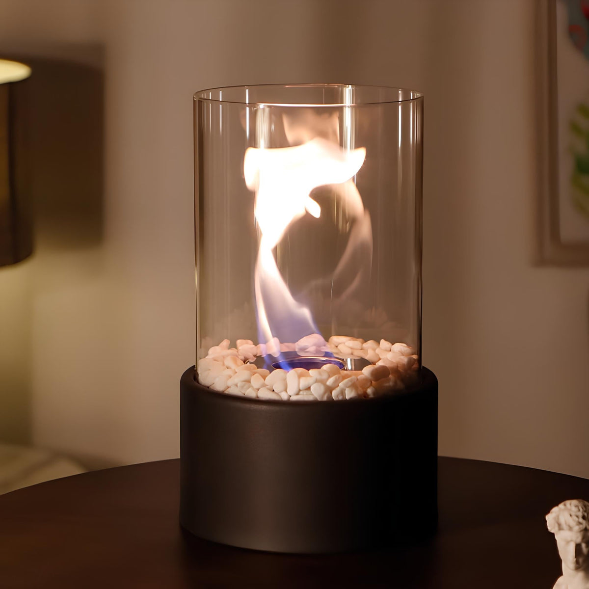 Black tabletop oil lamp flame rising inside a clear glass cylinder | Casa Norex