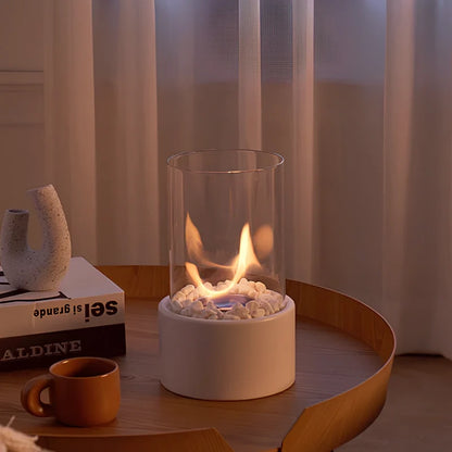 White oil lamp burning on a tray next to a kettle and cup — Casa Norex