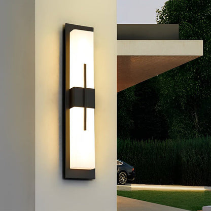 Tall rectangular outdoor wall light providing ambient light at modern entrance — Casa Norex