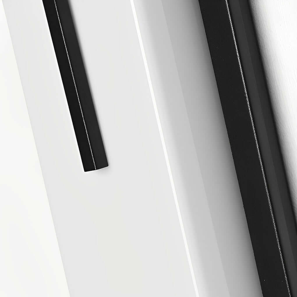Tall rectangular outdoor wall light close-up of sleek body in warm light — Casa Norex