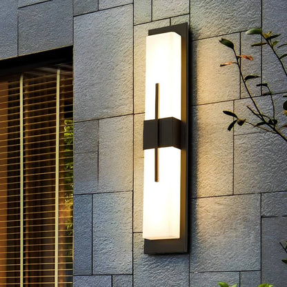 Tall rectangular outdoor wall light on gray stone wall — acrylic shade | Casa Norex