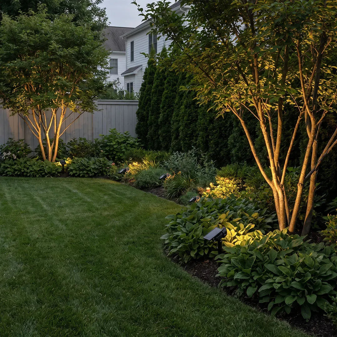 Solar lawn spot lights in a landscaped backyard garden — Casa Norex