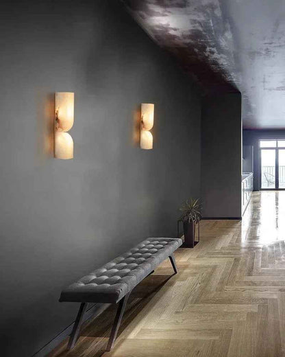 Wall sconce in bedroom setting — warm alabaster glow | Casa Norex