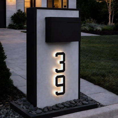 Illuminated number 39 mounted on a pillar beside a mailbox — Casa Norex