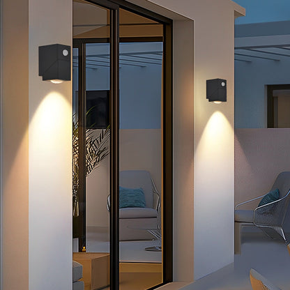 Up down outdoor wall light beside glass door with soft light — Casa Norex