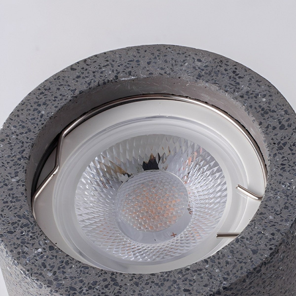 Concrete ceiling light in hallway setting — Casa Norex