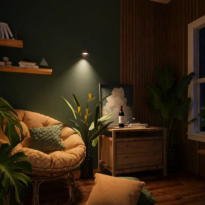 Cordless wall lamp over a nightstand beside a rattan chair — Casa Norex