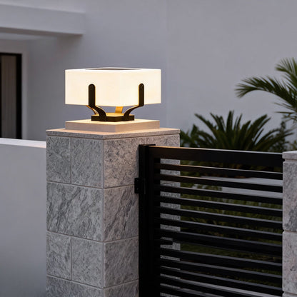 Plinth square outdoor pillar light on a gray brick pillar at an entrance