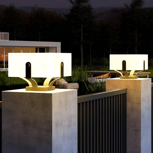 Plinth square outdoor pillar light beside a water feature