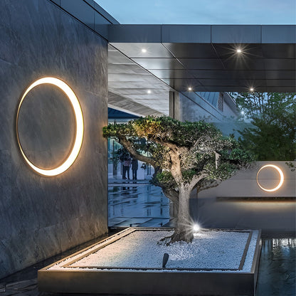 Round outdoor wall light on courtyard wall — architectural view | Casa Norex