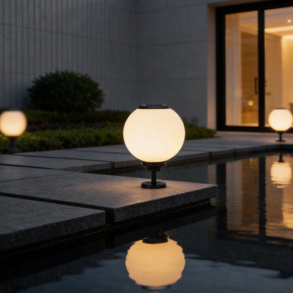 Orbit round solar outdoor pillar light at an inviting entrance pillar