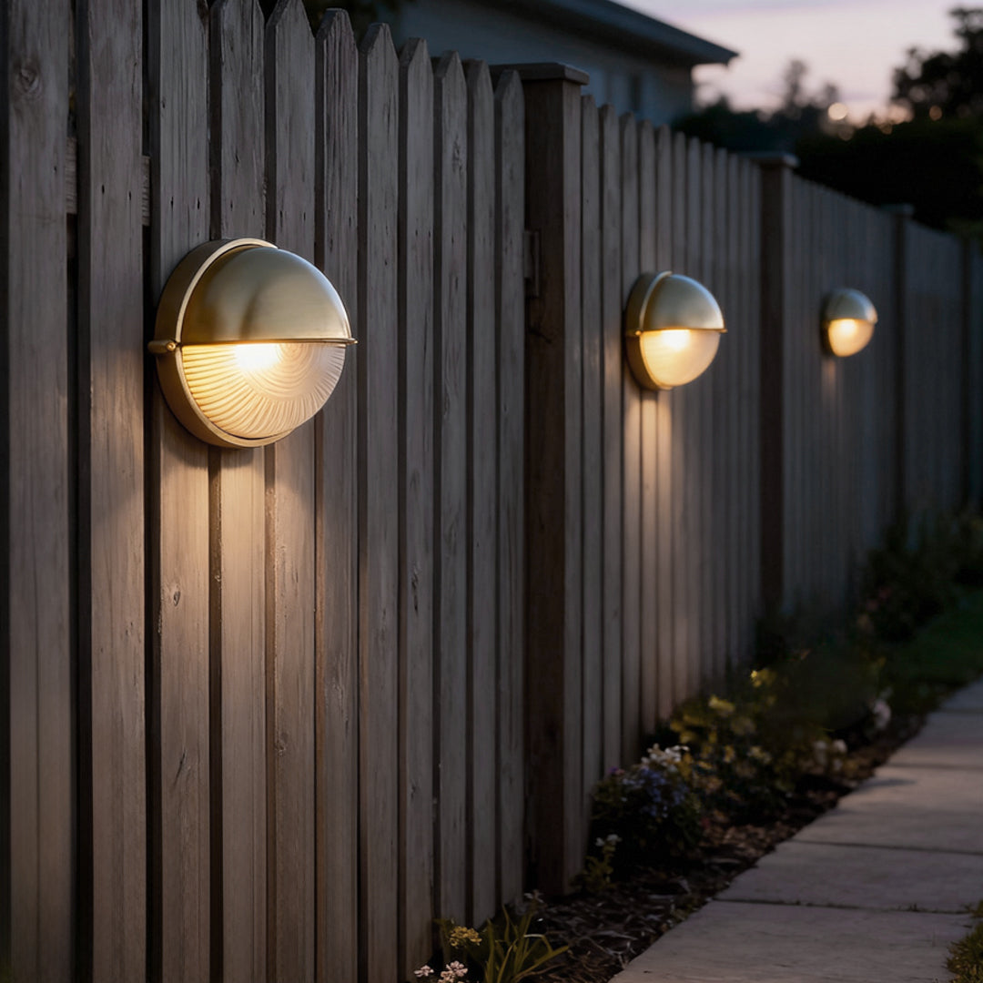 Bulkhead outdoor wall light oval shape beside wooden fence — Casa Norex
