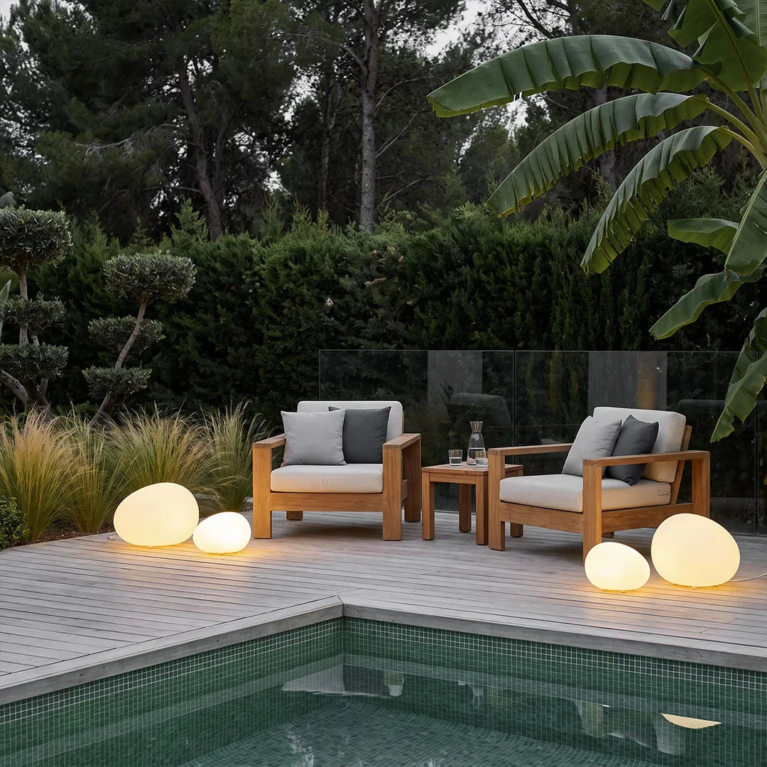 Cobble pebble lights on a modern pool patio — Casa Norex