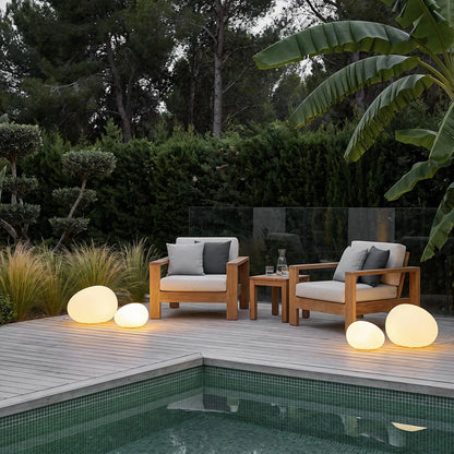 Cobble pebble lights on a modern pool patio — Casa Norex