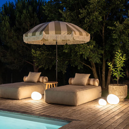 Cobble poolside lounge at night — Casa Norex