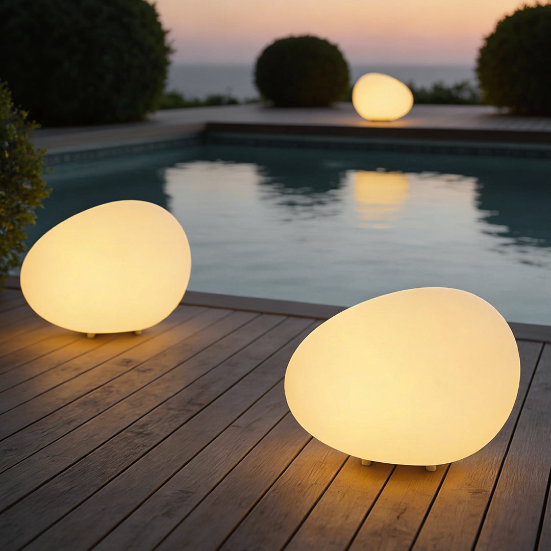 Cobble warm light in a modern pool area — Casa Norex