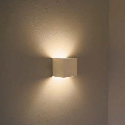 White cube wall light with a warm up-down glow — Casa Norex