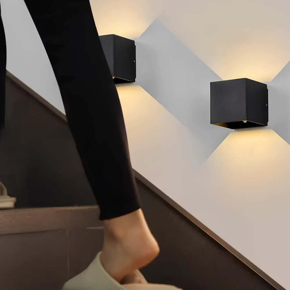 Black and white cube wall lights lighting a staircase wall — Casa Norex