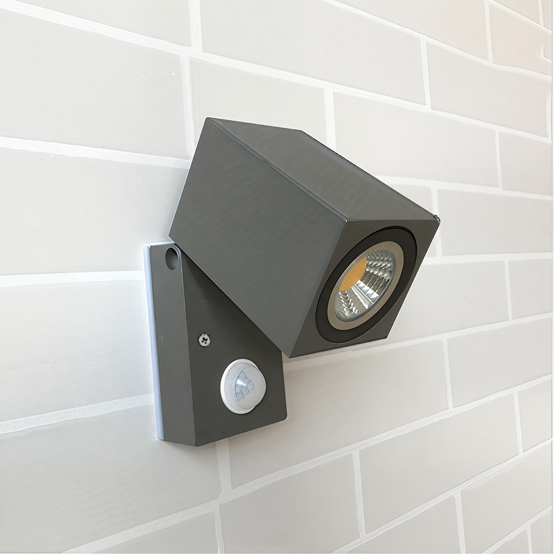 Kestrel angled black light on a white brick wall — Casa Norex