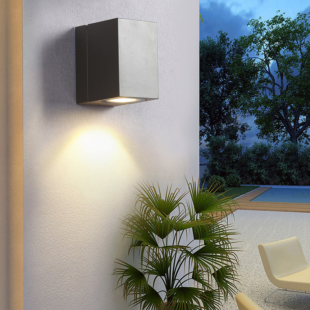 Kestrel sleek black wall light beside a potted plant | Casa Norex