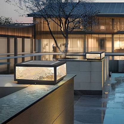 Merrin pillar light on a low courtyard wall | Casa Norex
