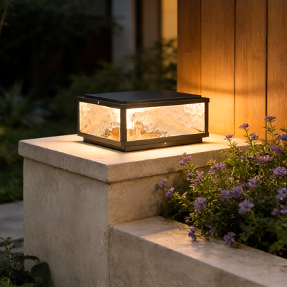 Merrin pillar light on a stone column by an exterior wall — Casa Norex