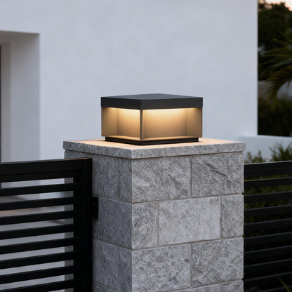 Forge post light on a stone column — Casa Norex